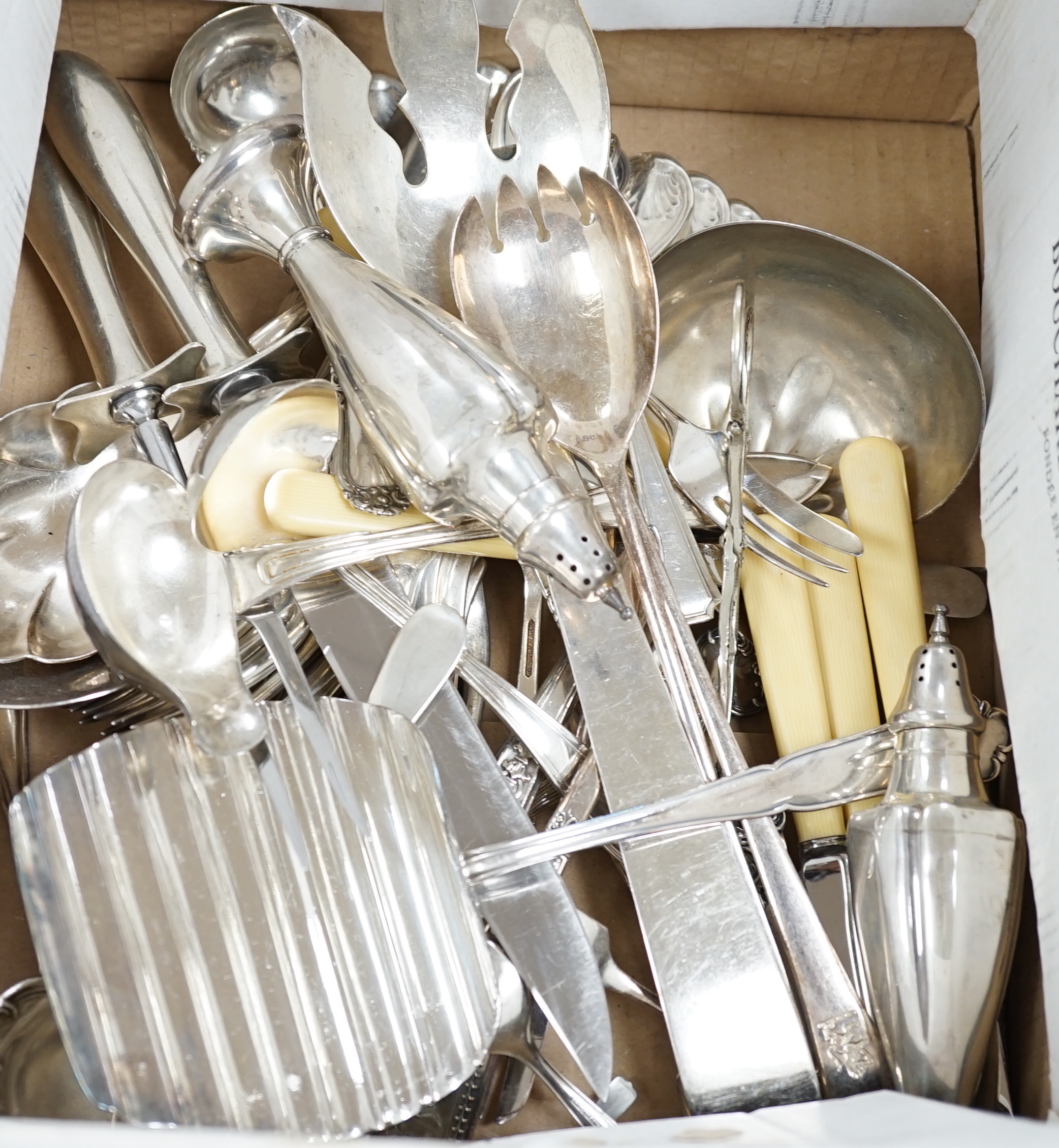 A pair of sterling pepperettes, five other sterling or 800 standard items of flatware and a quantity of silver plated flatware.